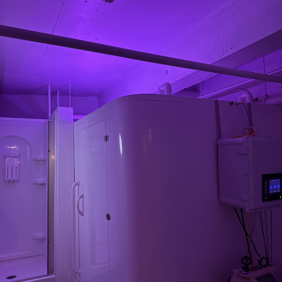 A float room lit in violet