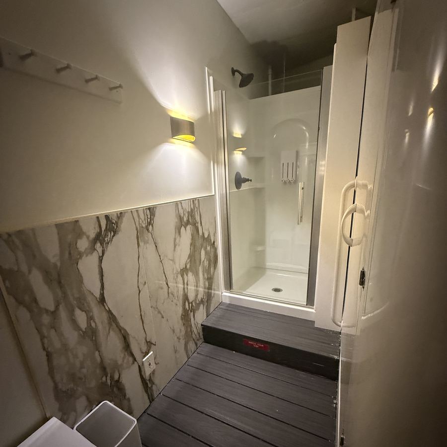Marble changing area with wall sconce